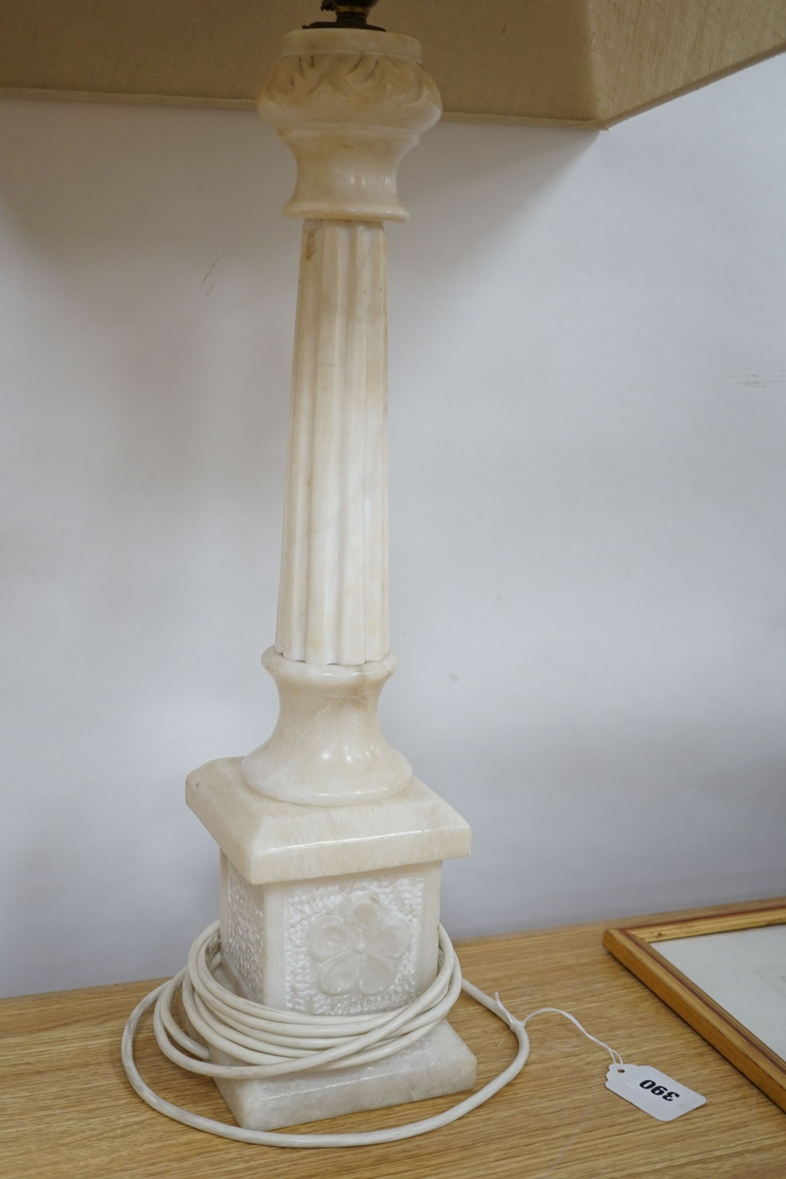 An alabaster desk lamp with shade